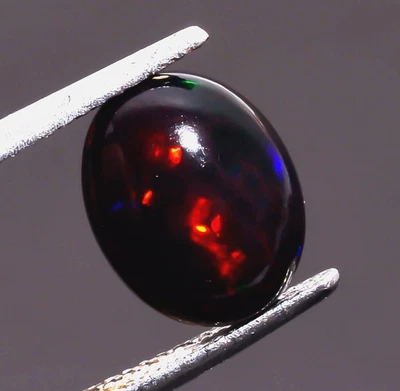 Piedra preciosa suelta cabujón forma ovalada ópalo etíope negro natural 1,5 quilates 11x9x4 mm Foto 1 de 3