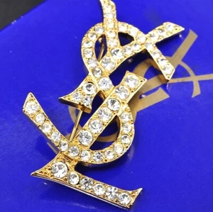 Yves Saint Laurent YSL OPIUM Brooch Gold Tone 13.0g w/Box,Storage Bag 112736 - Photo 1/12