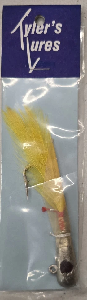 Vintage 1 Ounce Yellow Feather Jig Head With 5/0 Hook - Image 1 of 1