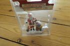 Lemax santa giving out presents in the snow figurine NEW