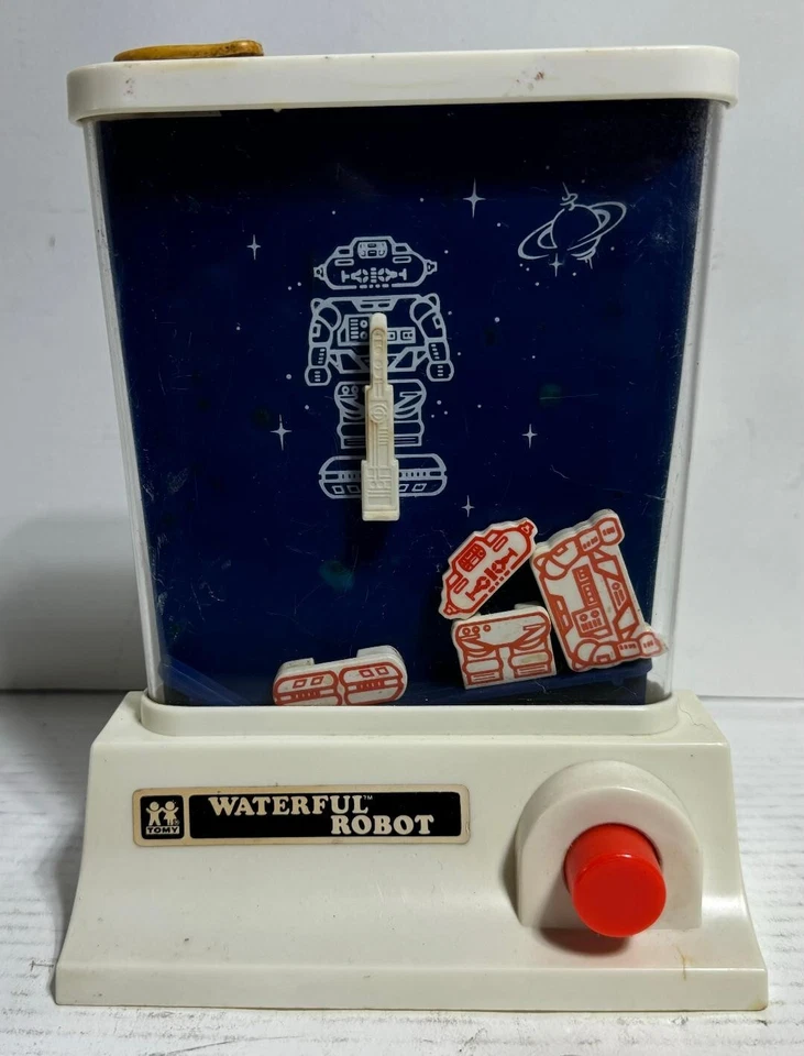 DE COLECCIÓN 1976 TOMY WATERFUL ROBOT ANILLO LANZAMIENTO AGUA PORTÁTIL JUEGO JUGUETE Foto 1 de 4