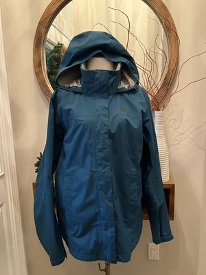 Chaqueta de Lluvia REI Rainier Para Mujer Grande Azul Teal Nylon Pico 2.5L Con Capucha Cremallera Completa Foto 1 de 4