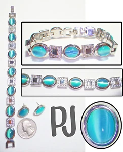 Set bracciale/orecchini firmati PJ ovale blu acqua occhio di gatto vetro e quadrato ST Link - Foto 1 di 7