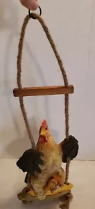 Playful Chicken Swinging i - Picture 1 of 5