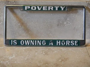Poverty Is Owning A Horse Metal Embossed License Plate Frame Tag Holder - Picture 1 of 1