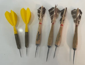 VINTAGE LOT OF 6 METAL TIP AND WOOD HANDLE CHAMPION THROWING DARTS AND PLASTIC - Picture 1 of 2