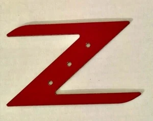 NUEVO AJUSTE NISSAN 350 Z 2003 - 2005 NUEVO ESTILO LOGO Z EMBLEMA ROJO LOGO PLÁCTIC 3M 1 PIEZA - Imagen 1 de 8