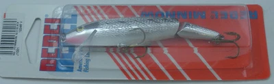 Corredor raso flutuador de minnow articulado Rebel J1001 3-1/2" 1/4 oz prata/preto - Imagem 1 de 4