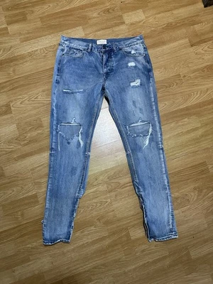Pantalones de mezclilla Fear of God para hombre 36x32" azules desgastados ajustados cremallera al tobillo cuarta colección Foto 1 de 4
