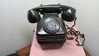 Black Bakelite phone with side crank on it. One crack on the side. Cord bad.