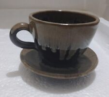 A pottery cup with a plate decorated in an ancient craftsmanship