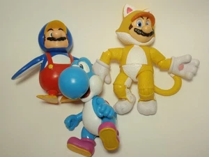 Lot 3 Jakks Pacific Super Mario Spielfiguren: Pinguin, Katze, Lt Blue Yoshi - Bild 1 von 7