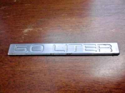 1986 1987 1988 1989 Cadillac Brougham d'elegance - 5.0 Liter Trunk Emblem - Image 1 of 4