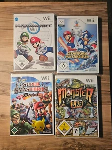 4 Wii-Spiele im Paket - Mario Kart, Mario und Sonic, Smash Bros Anleitungen inc. - Bild 1 von 5