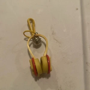 1980's BELL CHARM Plastic Charm YELLOW RED HEADPHONES - Picture 1 of 2