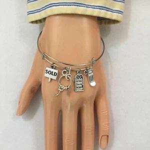 The REALTOR Silver Alloy Charms Expendable Bangle Bracelet. - Picture 1 of 3