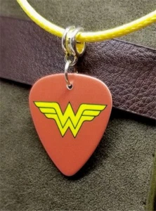 Wonder Woman Emblem Guitar Pick Necklace on Yellow Rolled Cord - Picture 1 of 2