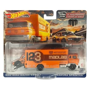 Hot Wheels HKF44 Premium Mad Mike Mazda RX3 GT Team Transport NUEVO & EMBALAJE ORIGINAL - Imagen 1 de 1