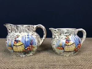 2 X VINTAGE EMPIRE WARE SHELTON IVORY CRINOLINE LADY CHINTZ GRADUATED JUGS - Picture 1 of 9