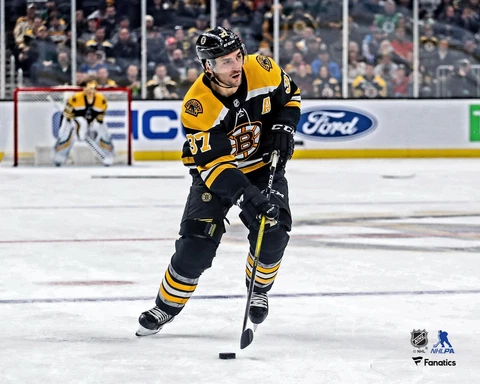 Patrice Bergeron Boston Bruins Unsigned Black Jersey Skating 8" x 10" Photo Cover