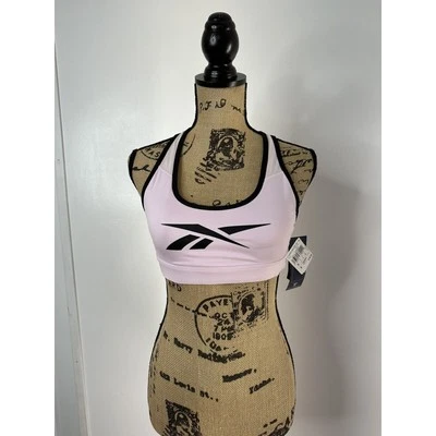 Sujetador deportivo Reebok Hero Racerback talla pequeña acolchado impacto medio Speedwick rosa Foto 1 de 4