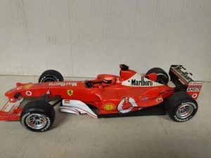FERRARI F1 2003 FORMULA F1 SCHUMACHER 1:18 HOT WHEELS DEFECT/ROTO/NO BOX - Imagen 1 de 6