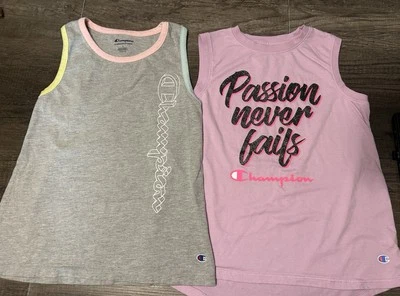 Conjunto de dos camisetas deportivas sin mangas Champion para niñas talla 10/12 usadas en excelente estado Foto 1 de 3