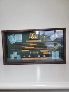 Historia enmarcada del golf-evolución de hierros y pelotas en caja de sombra - Imagen 1 de 8