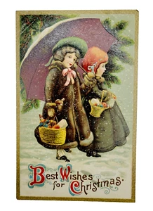 Best Wishes for Christmas Two Girls Snowy Walk Gift Baskets 1910s Postcard Used - Picture 1 of 2