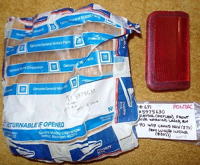 1990 Pontiac Grand Prix RH Front Door Warning Lamp NOS 5975630 - Image 1 of 3