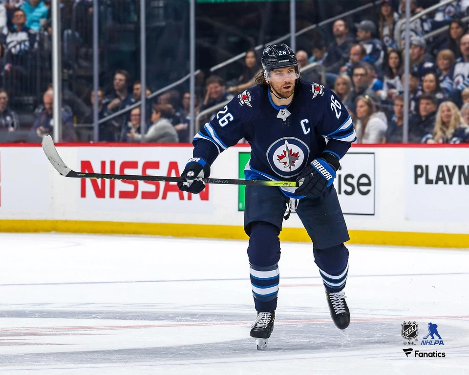 Blake Wheeler Winnipeg Jets Unsigned Blue Jersey Skating Photo - Image 1 of 1