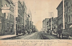SPRINGFIELD OHI~STREET SCENE-HENRY BLOCK-BICYCLE SIGN & LOT MORE~1907 POSTCARD - Picture 1 of 2