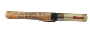Tubo de aceite de celuloide vintage UNCLE CHARLIE'S MAGIC OIL MERCURY WHEEL CO 1/3 FL OZ - Imagen 1 de 12