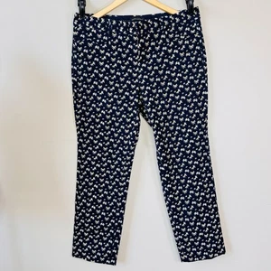 Banana Republic Hose Gr. 12 gerades Bein schwarz Gänseblümchen Blumendruck Sloan dehnbar - Bild 1 von 5