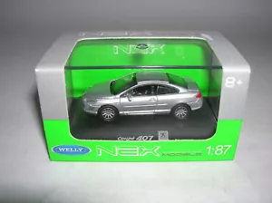 Welly Peugeot 407 Coupé argento argento, 1:87 H0 art. 73111 nuovo + IMBALLO ORIGINALE - Foto 1 di 3