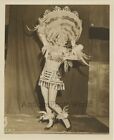 Woman circus performer in Indian Native American feather costume vintage photo