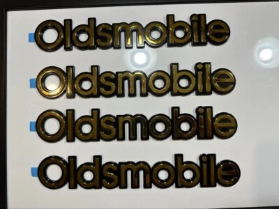 New Gold Plated Rear Emblem Name Plate Oldsmobile Logo 10"x1.25" Stick On Badge - Image 1 of 4