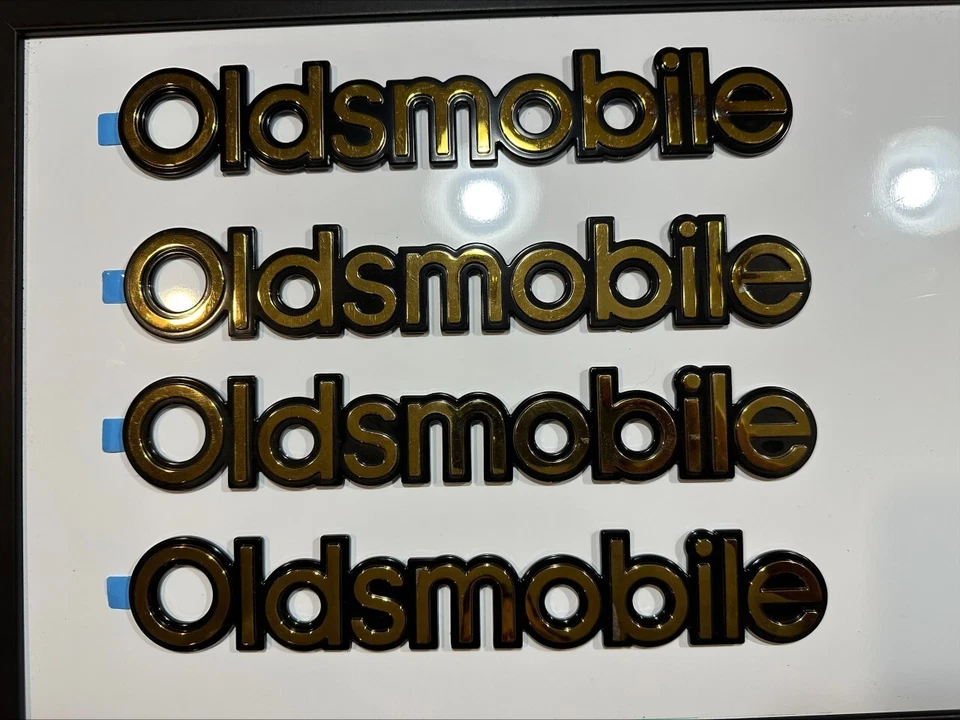 Nuevo emblema trasero chapado en oro placa de identificación logotipo Oldsmobile 10"x1.25" insignia adhesiva Foto 1 de 4