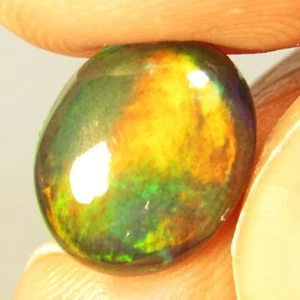 Piedra preciosa ovalada de ópalo negro juego multicolor natural de disparo de 2,57 quilates de Etiopía - Imagen 1 de 4