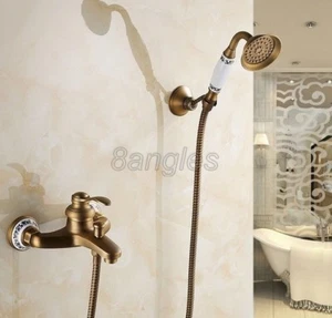 Antiguo grifo de ducha de baño de latón con cabezal de ducha de mano montado en la pared - Imagen 1 de 3