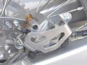 Works Al Rear Brake Caliper Guard for Kawasaki KDX220R 97-05 - Picture 1 of 4