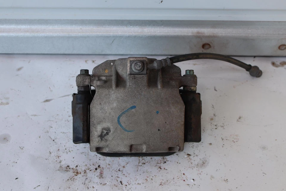 Pinza de freno trasera izquierda del lado del conductor Chevy Tahoe 2007-2020 con manguera OEM Foto 1 de 4