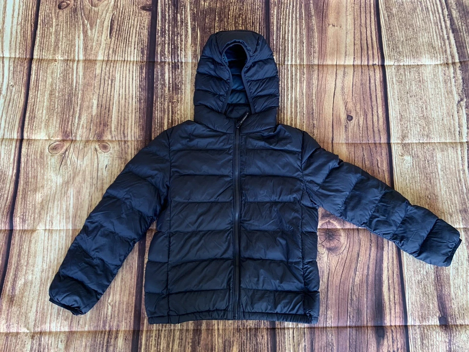 Chaqueta acolchada con capucha azul marino cremallera completa manga larga Uniqlo para niños talla: 9-10 Foto 1 de 4