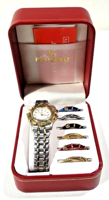 Reloj Mujer Peugeot Plateado Biseles Intercambiables Correa Ajustable Necesita Batería Foto 1 de 4