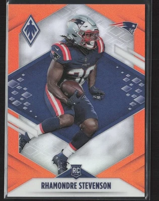 2021 Panini Phoenix #133 Rhamondre Stevenson Orange Holo #/99 Rookie RC - Image 1 of 2