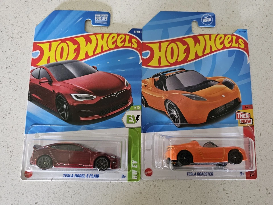 2 Tesla Hot Wheels, 1 Red Models S Plaid Ev, 1 Orange Roadster Then & Now New - Image 1 of 4