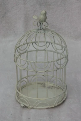 Jaula metálica para pájaros con pájaro en soporte superior popurrí Foto 1 de 4