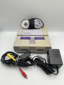 Console Super Nintendo SNES avec 1 manette OEM + tous les cordons OEM - TESTÉE - Photo 1/13