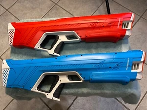 spyra two red and blue re-chargeable powerful water guns, work great. - Picture 1 of 19
