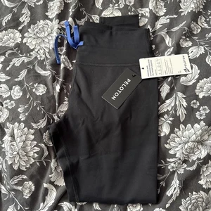 Peloton leggings anteriori con cravatta alta precisa e carica M - Foto 1 di 8